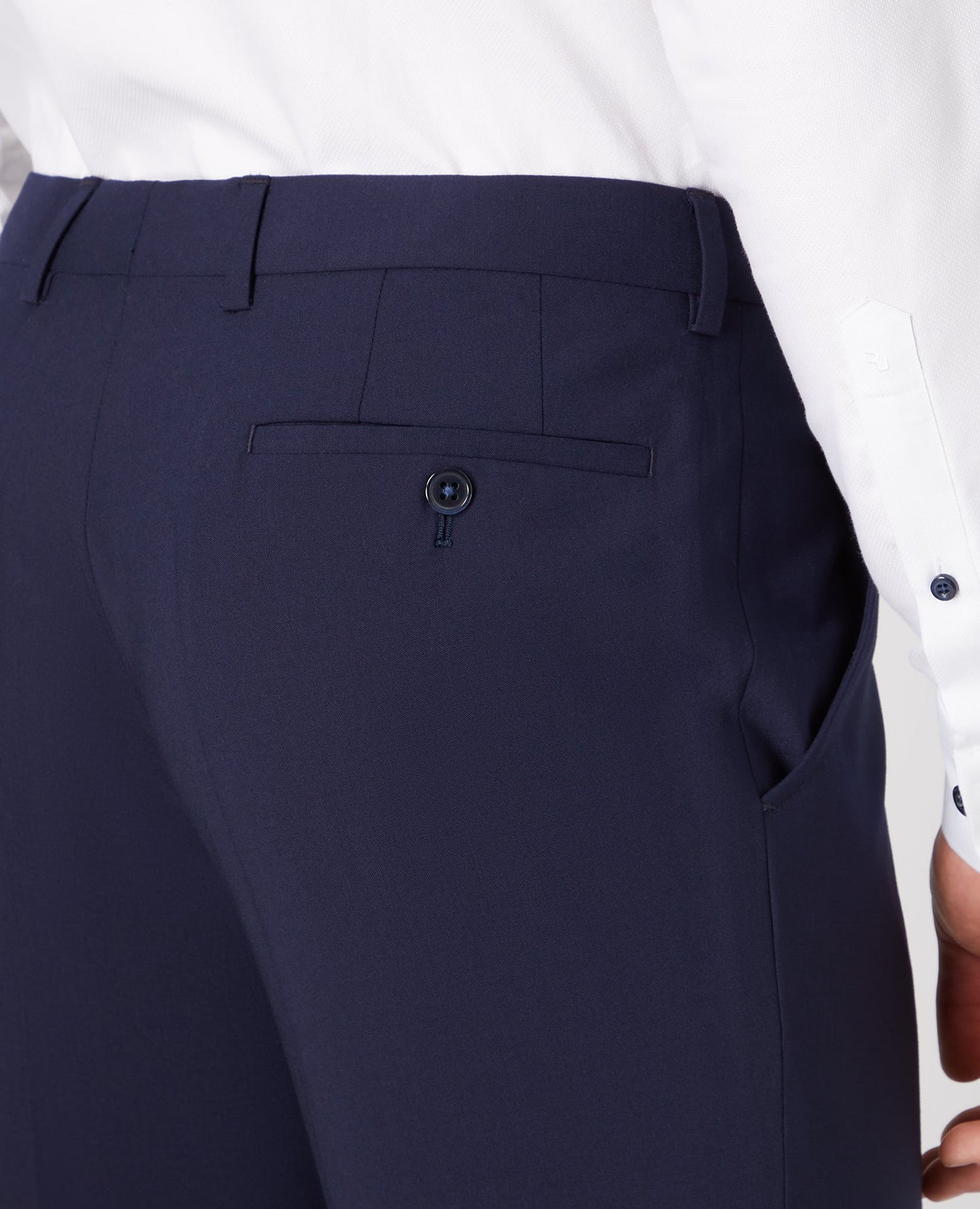 Man wearing a navy Tapered Leg Wool-Blend Suit Trouser