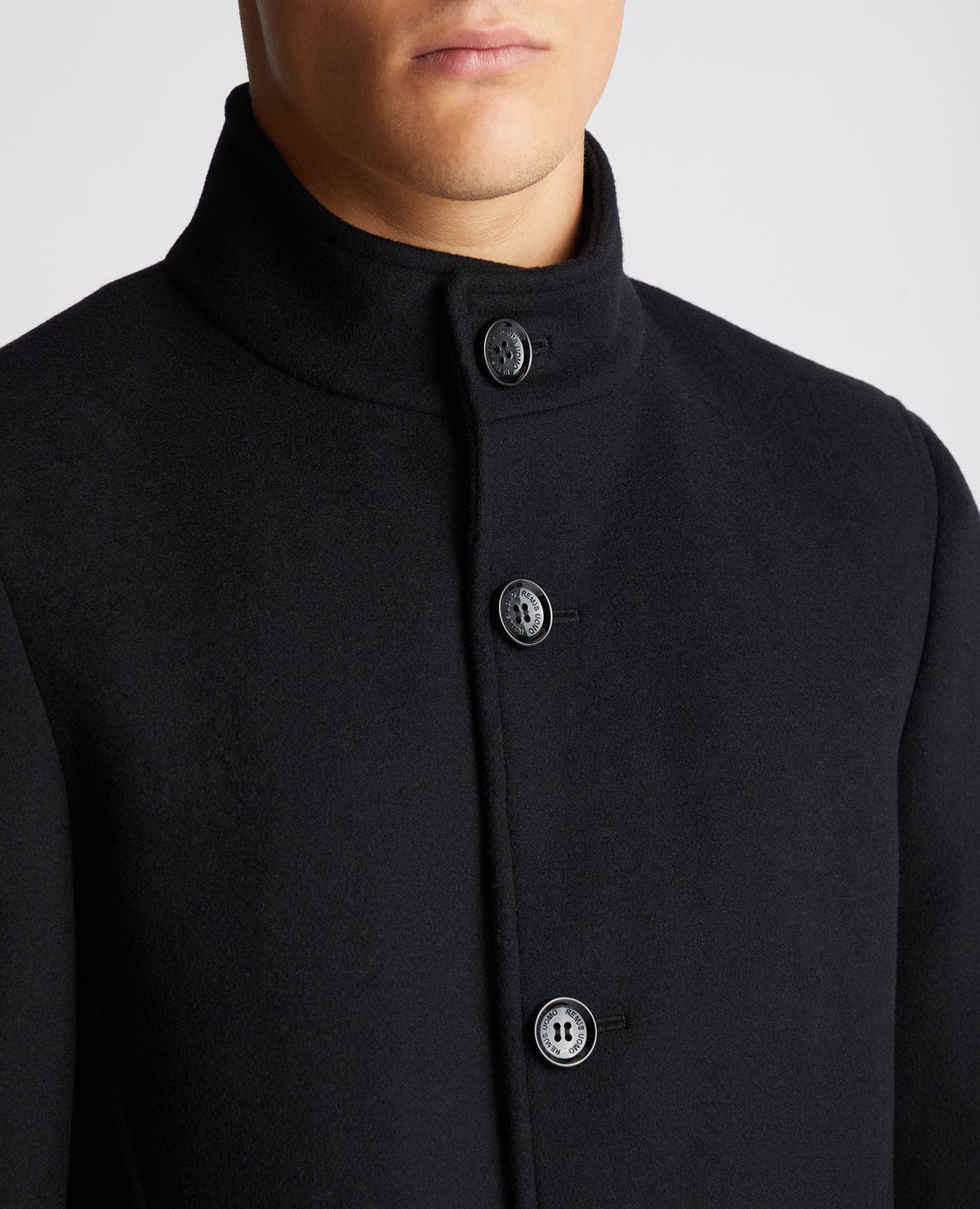 Man wearing a black Tapered Fit Wool-Mix Tailored Coat
