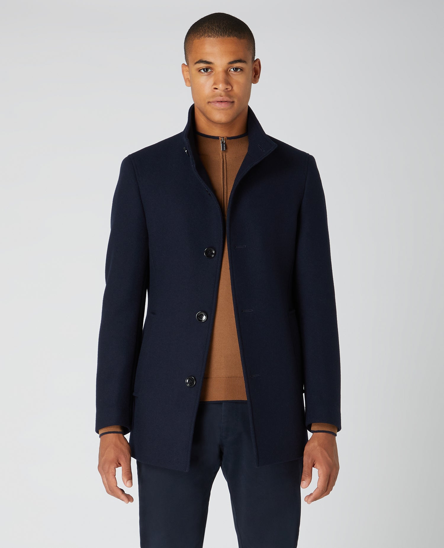Man wearing a navy Tapered Fit Wool-Blend Tailored Coat