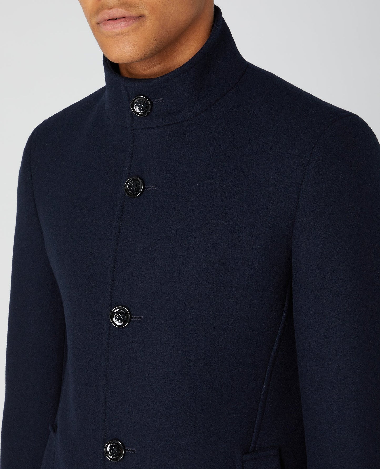 Man wearing a navy Tapered Fit Wool-Blend Tailored Coat