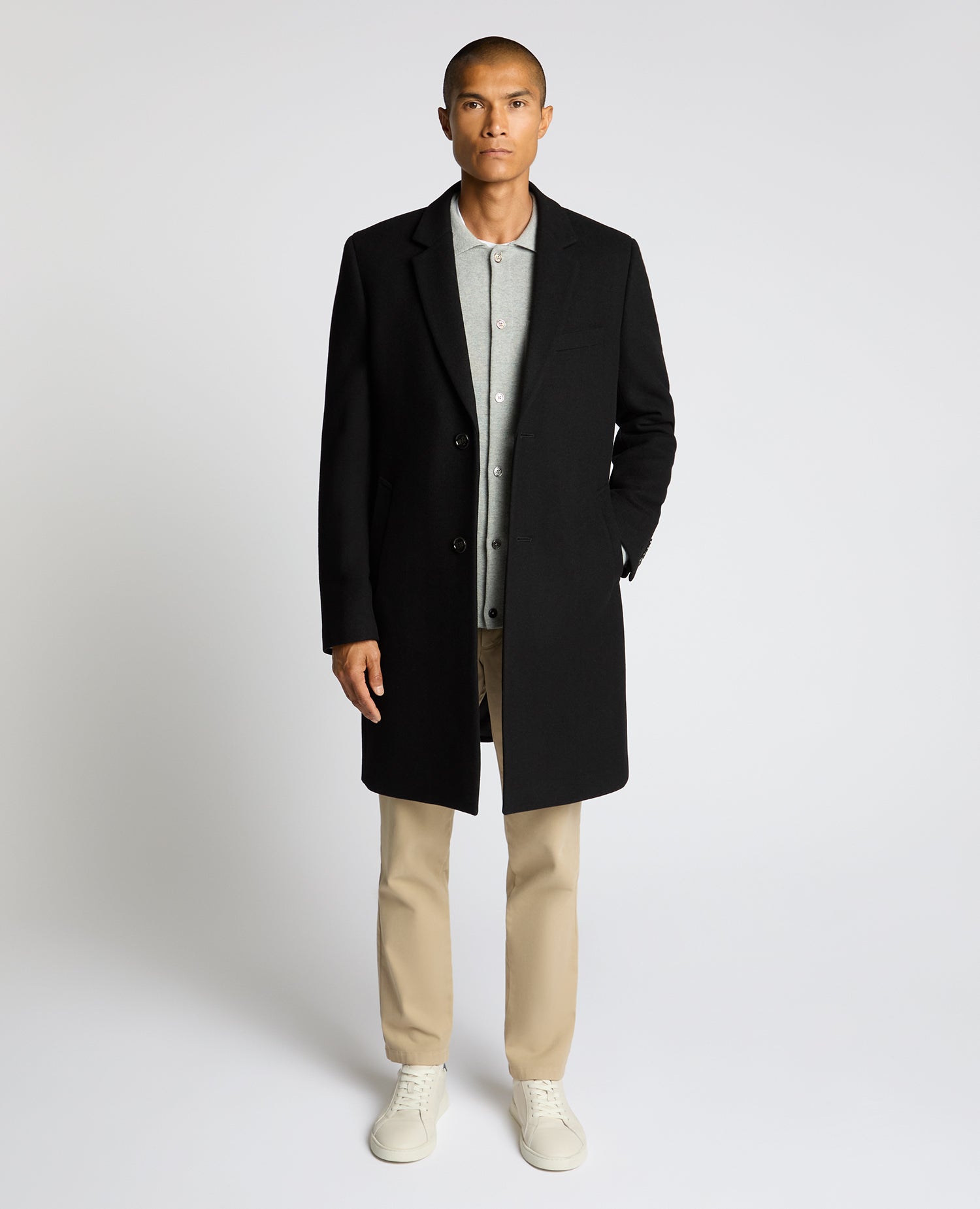 Man wearing a black Kayden Tailored Fit Chelsea Overcoat