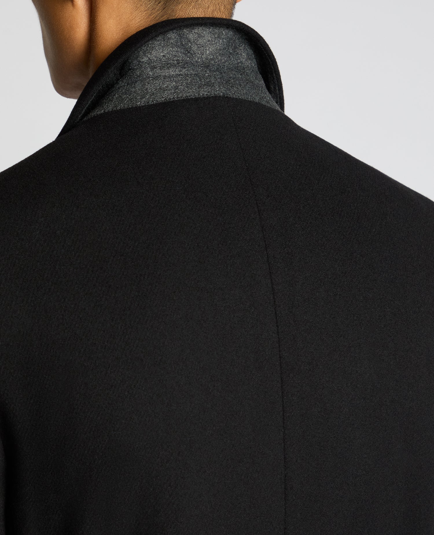 Man wearing a black Kayden Tailored Fit Chelsea Overcoat