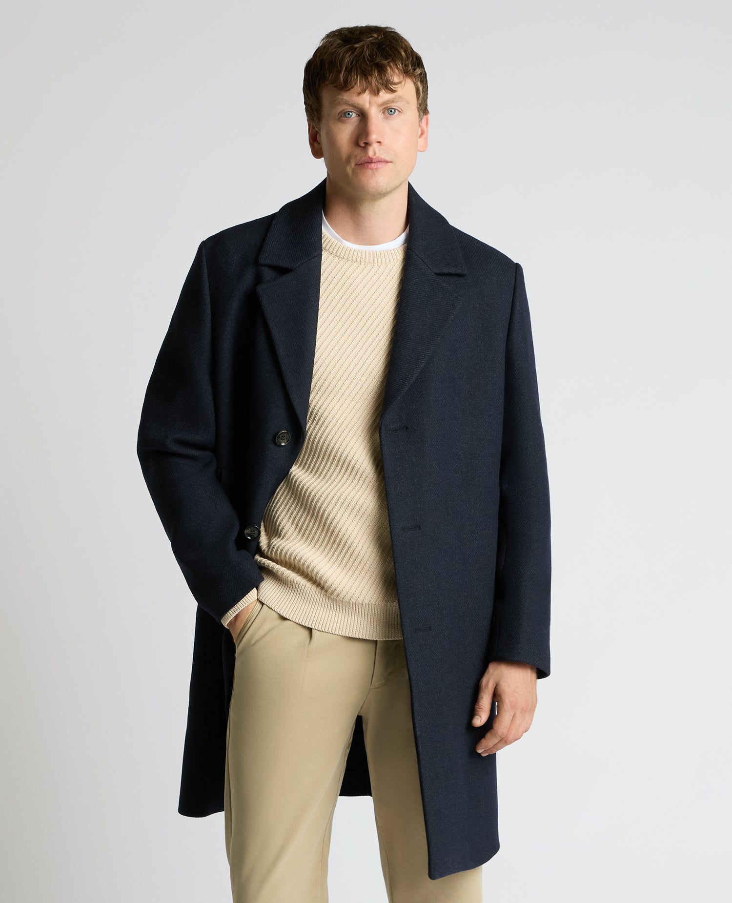 Man wearing a navy Dylan Relaxed Fit Wool Blend Coat