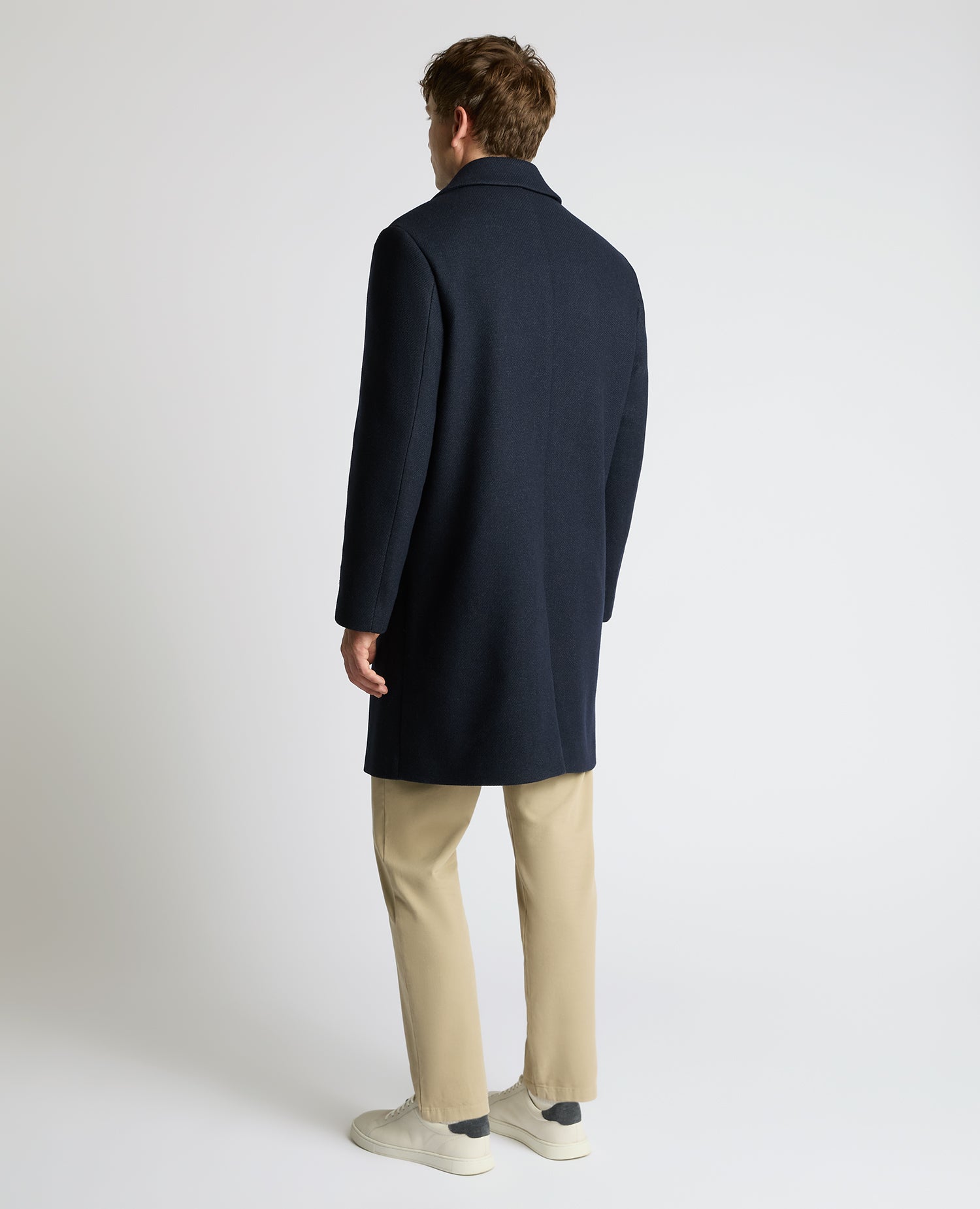 Man wearing a navy Dylan Relaxed Fit Wool Blend Coat