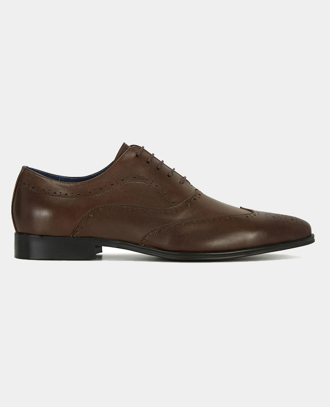 Man wearing a brown Leather Wingtip Brogue