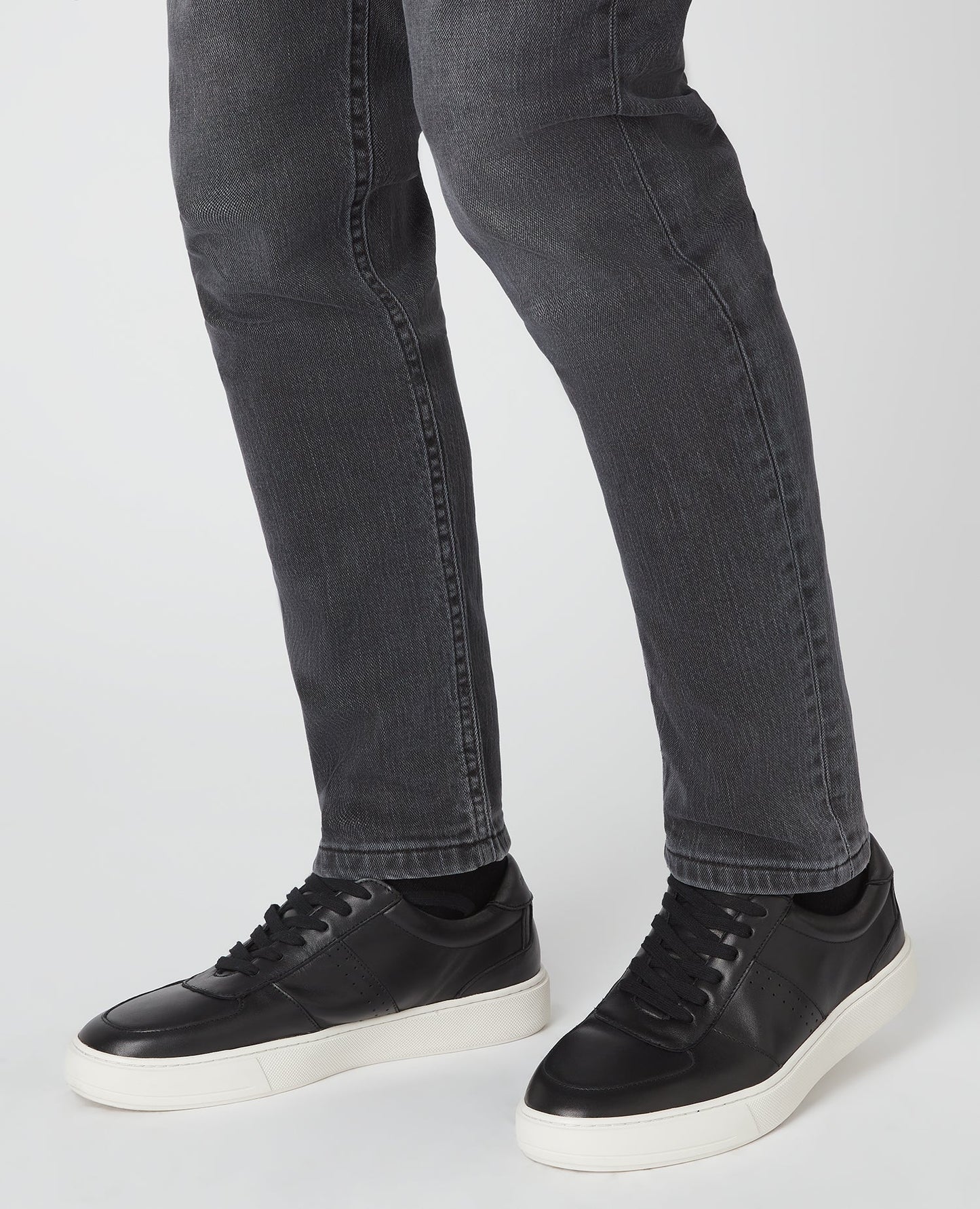 Man wearing a black Leather Trainer