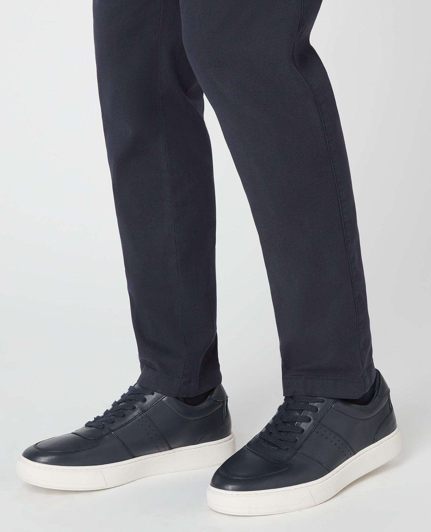 Man wearing a navy Leather Trainer
