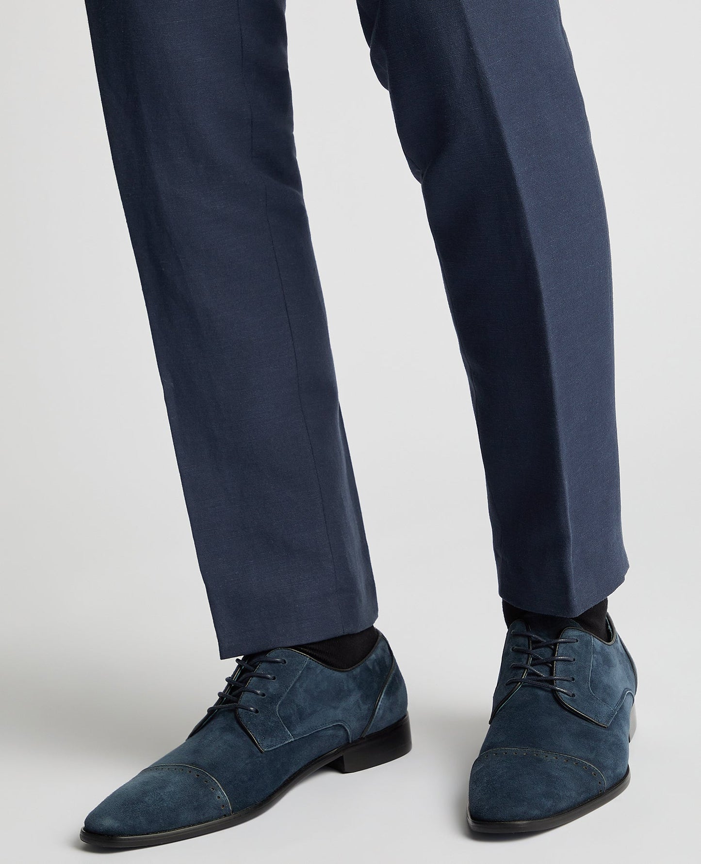 Man wearing a blue Suede Bonuci