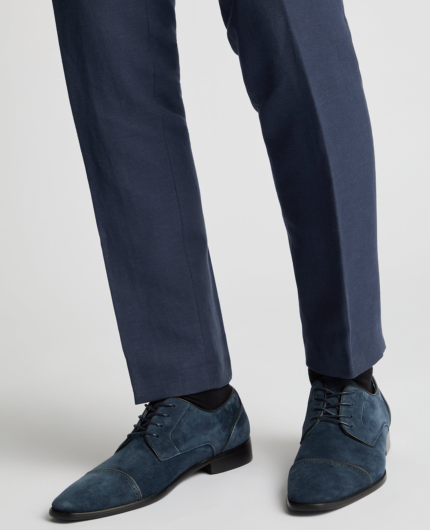 Man wearing a blue Suede Bonuci