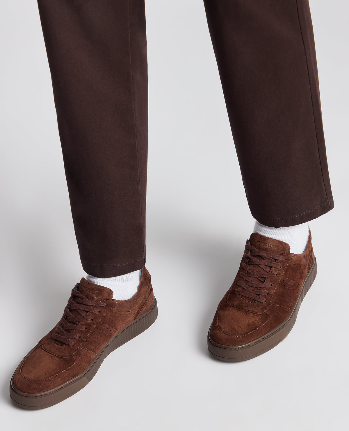 Man wearing a brown Suede Enrico Trainer