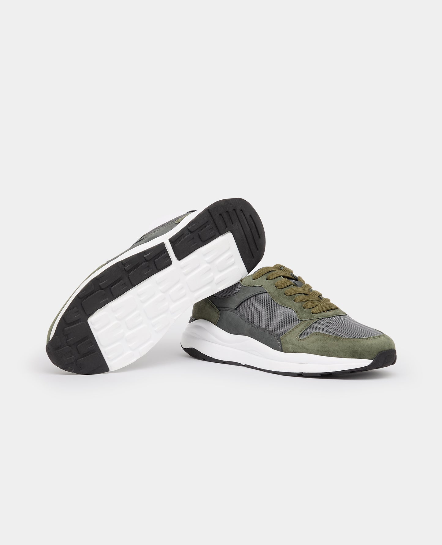 Man wearing a green Suede Albi Trainer