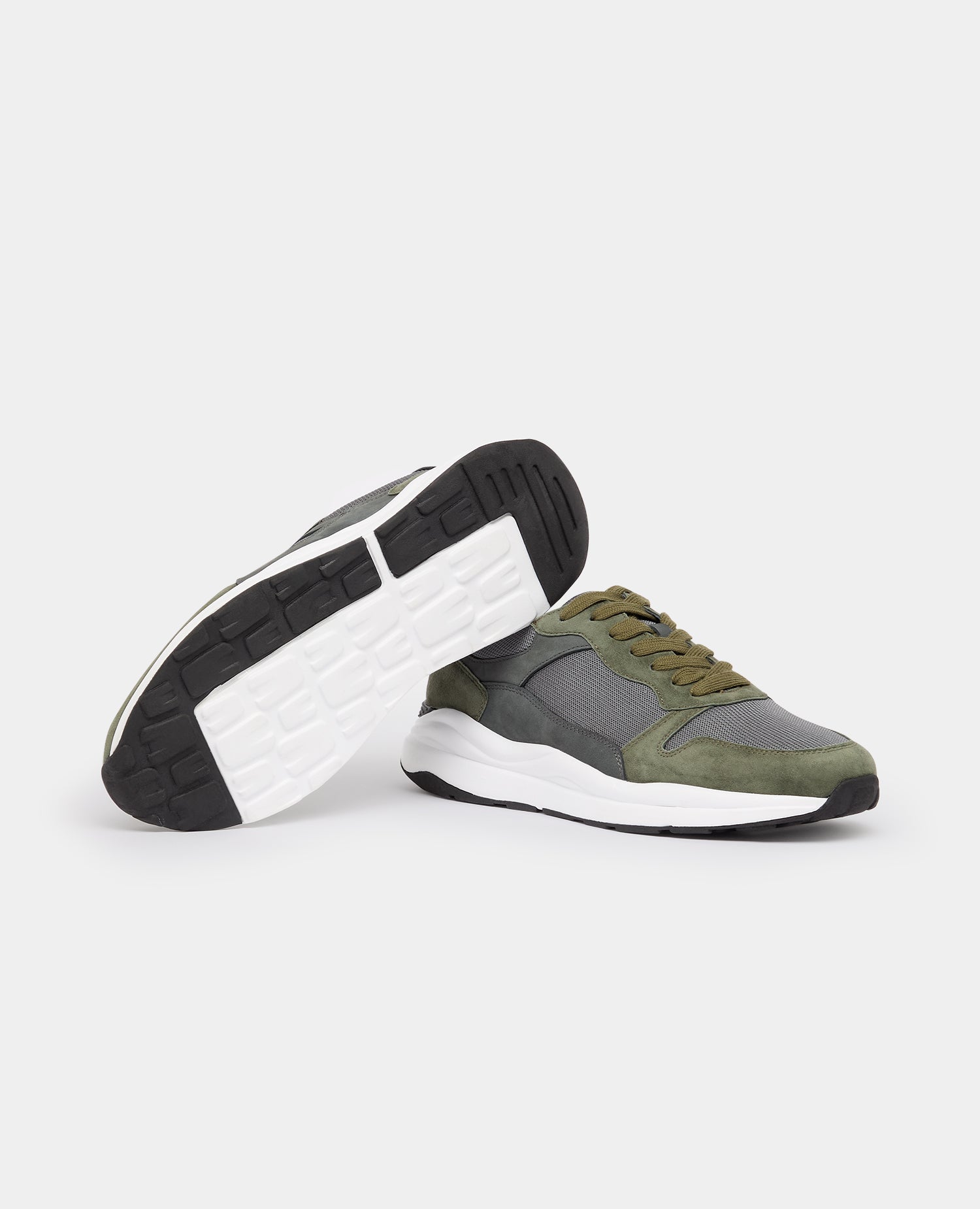 Man wearing a green Suede Albi Trainer