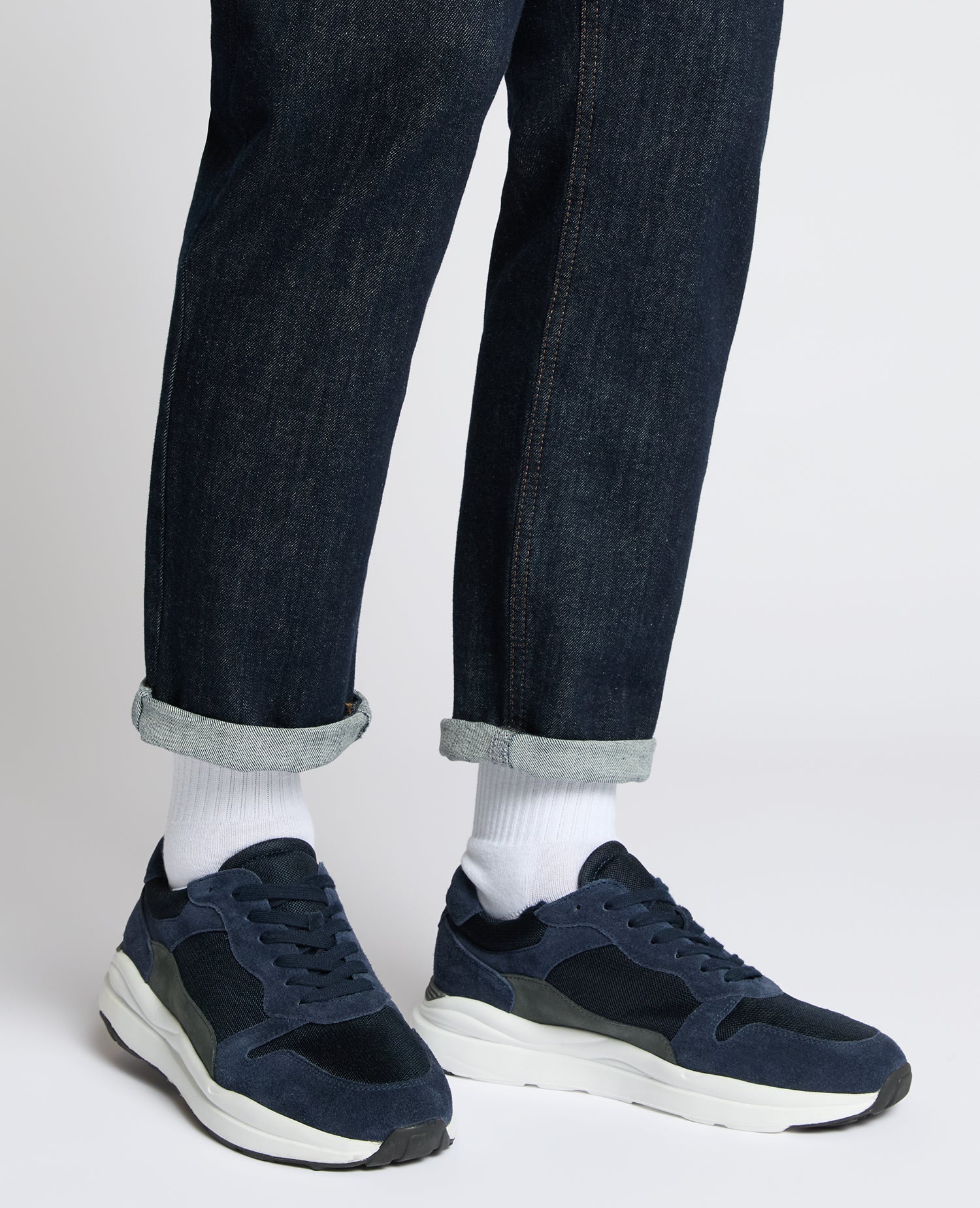 Man wearing a navy Suede Albi Trainer
