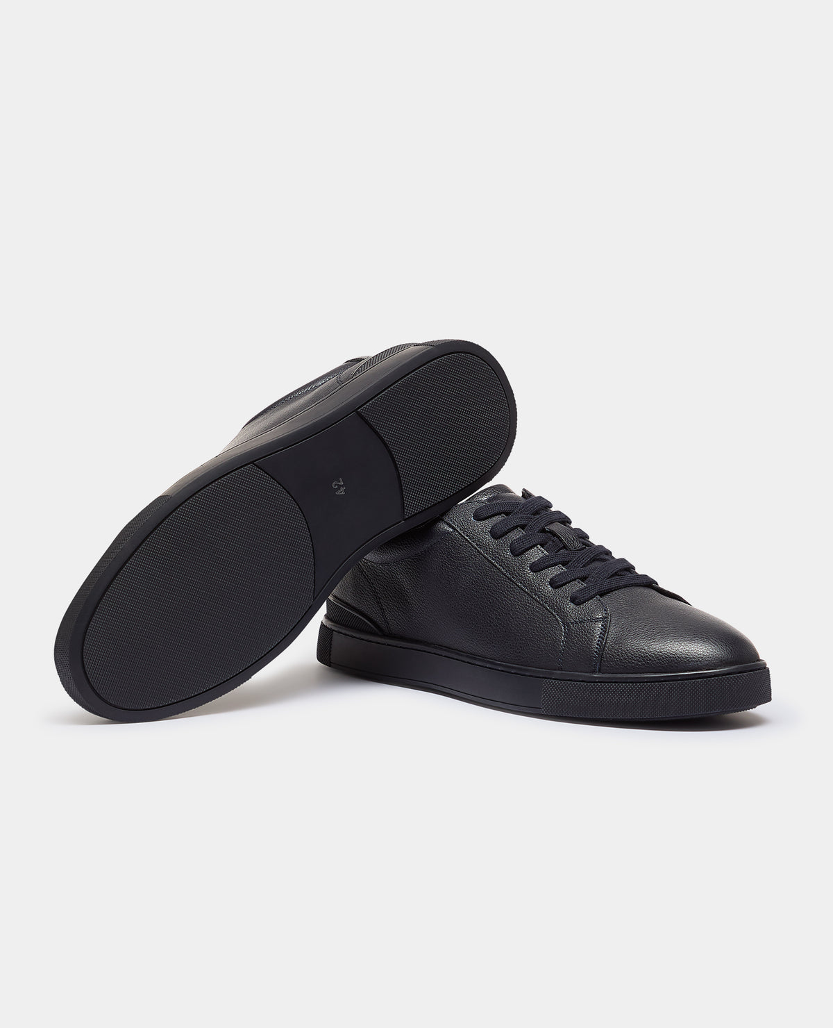 Man wearing a navy Shoe