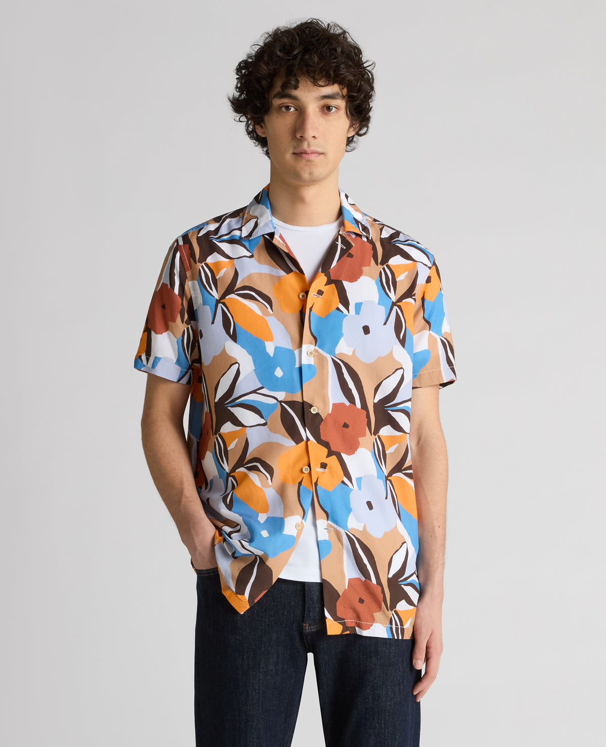 Man wearing a blue Tapered Fit Tencel Floral Print shirt