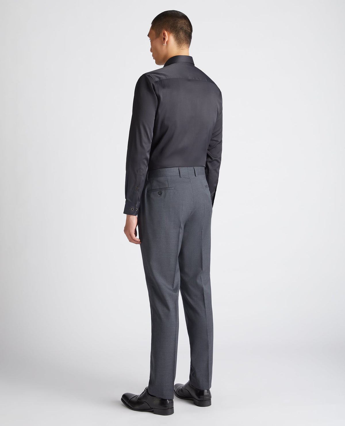 Man wearing a black Tapered Fit Cotton-Blend Stretch Shirt