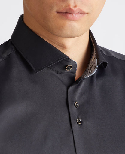 Man wearing a black Tapered Fit Cotton-Blend Stretch Shirt