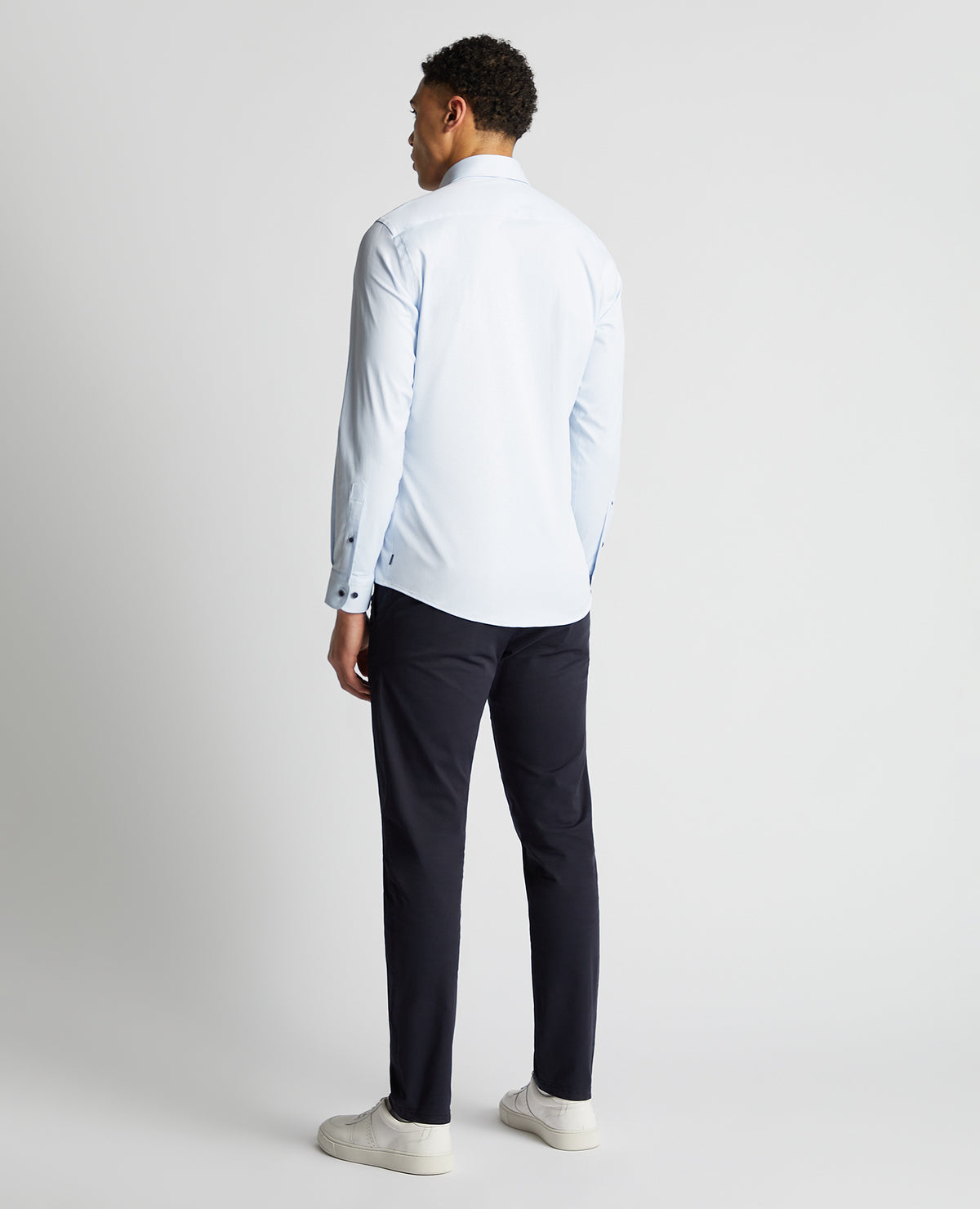 Man wearing a blue Tapered Fit Cotton-Blend Stretch Shirt