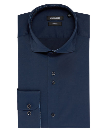 Man wearing a navy Tapered Fit Cotton-Blend Stretch Shirt