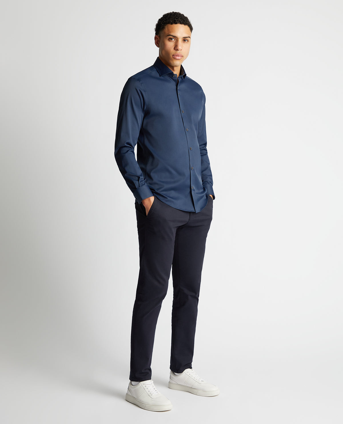 Man wearing a navy Tapered Fit Cotton-Blend Stretch Shirt