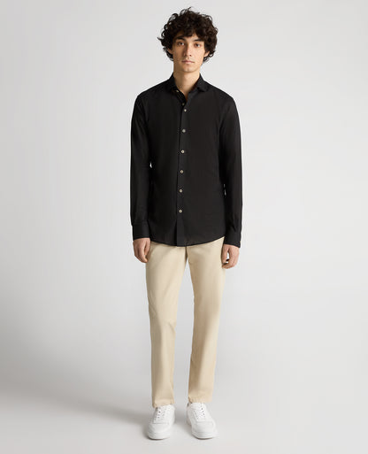 Man wearing a black Tapered Fit Cotton-Linen Blend Shirt