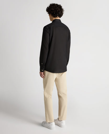 Man wearing a black Tapered Fit Cotton-Linen Blend Shirt