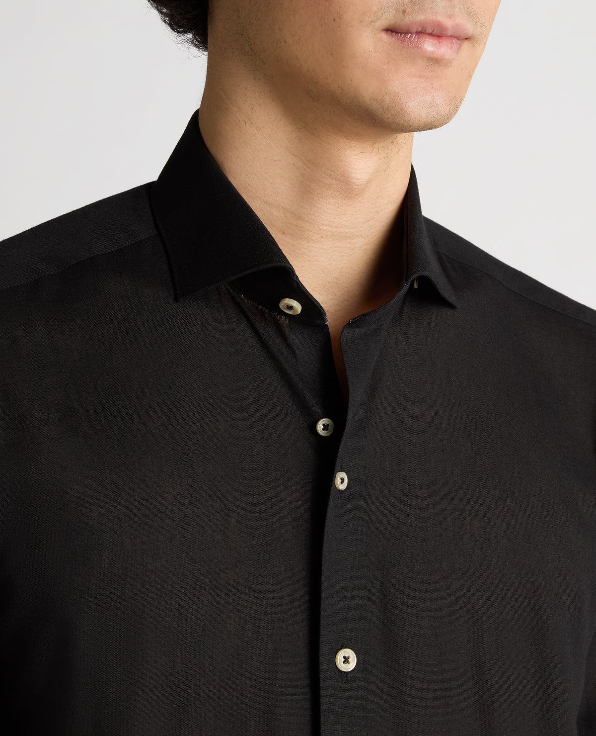 Man wearing a black Tapered Fit Cotton-Linen Blend Shirt