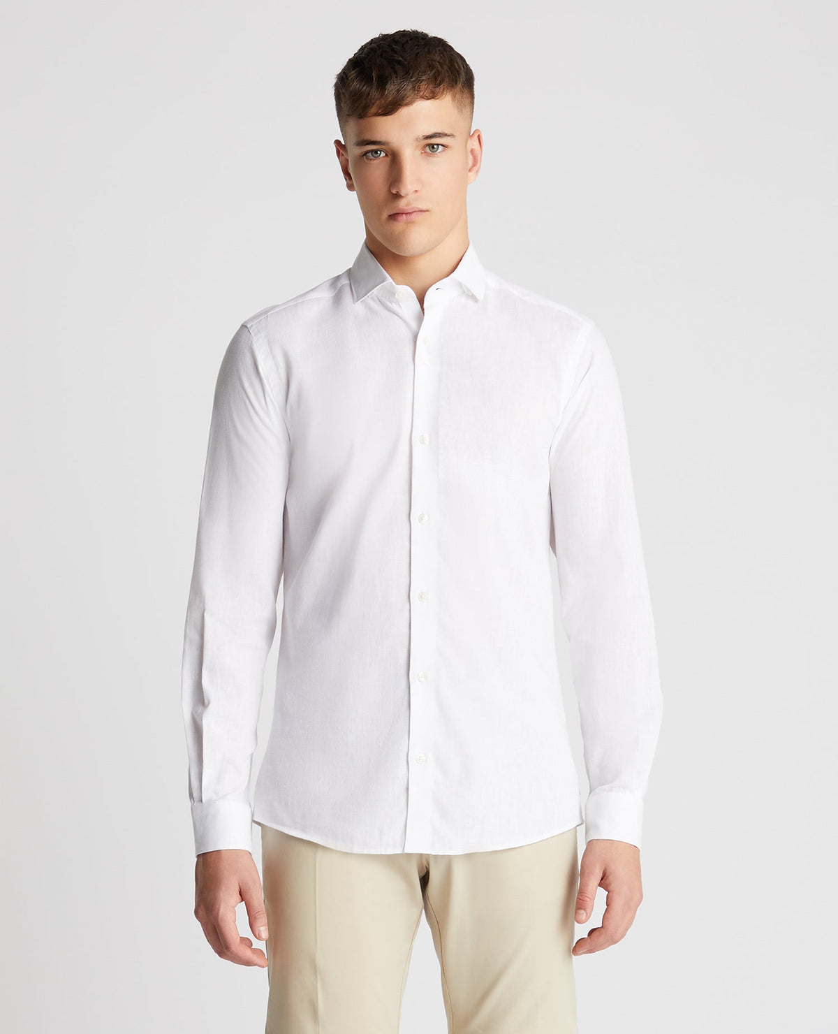 Man wearing a white Tapered Fit Cotton-Linen Blend Shirt