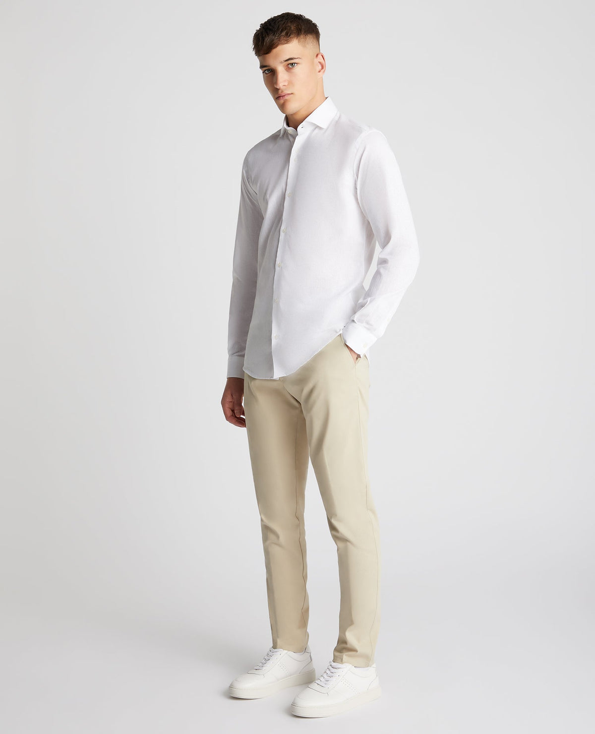 Man wearing a white Tapered Fit Cotton-Linen Blend Shirt