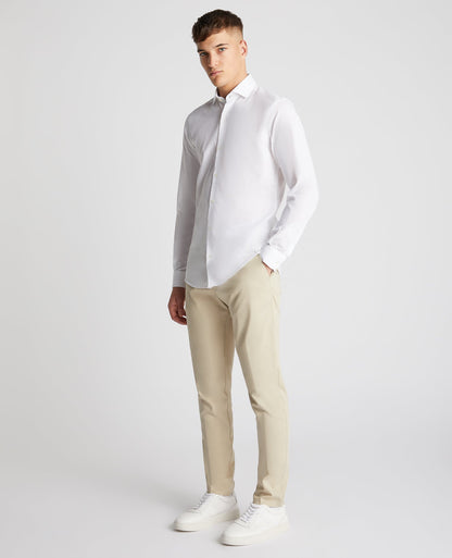 Man wearing a white Tapered Fit Cotton-Linen Blend Shirt