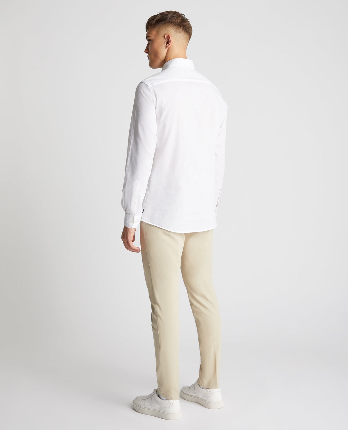 Man wearing a white Tapered Fit Cotton-Linen Blend Shirt