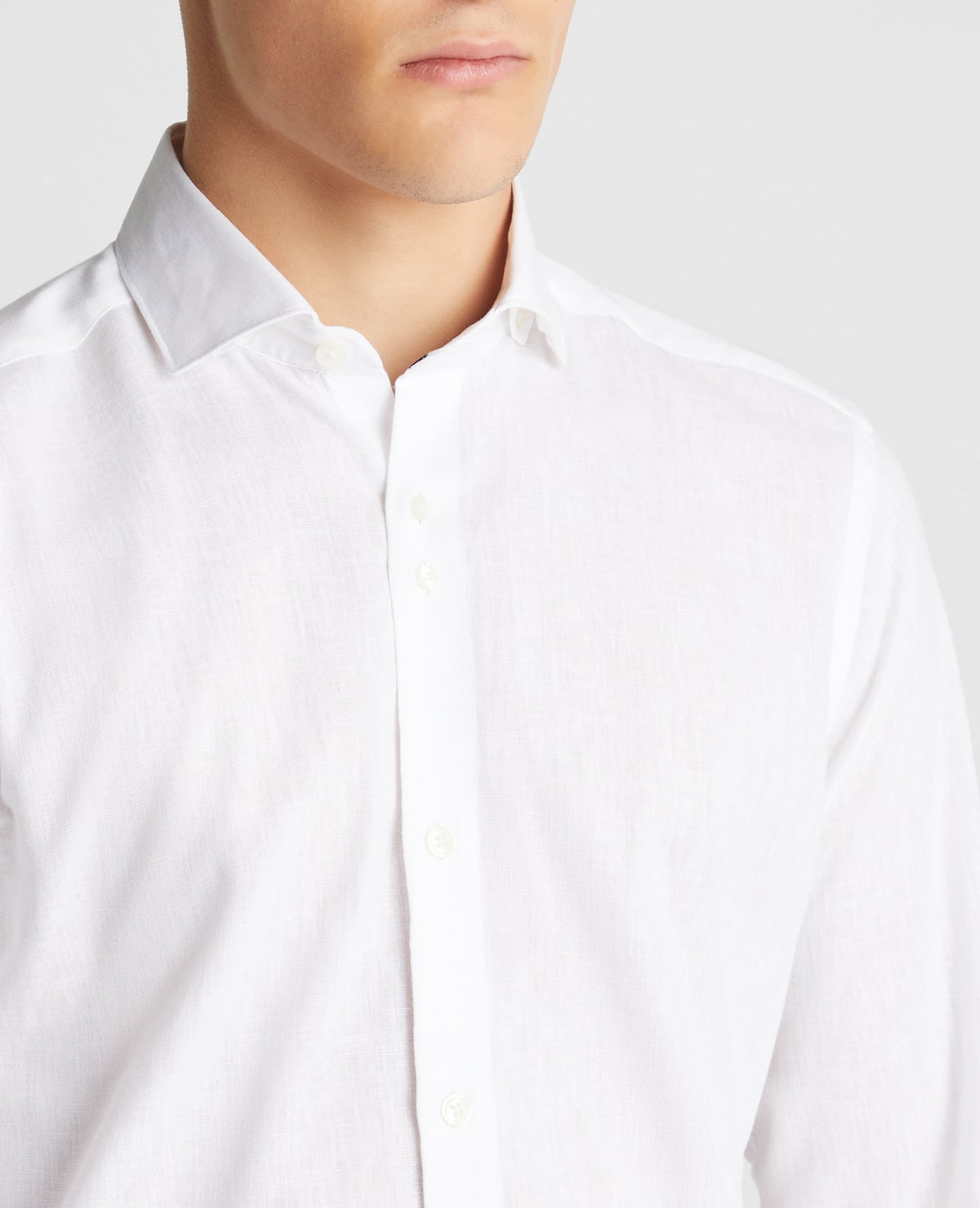 Man wearing a white Tapered Fit Cotton-Linen Blend Shirt