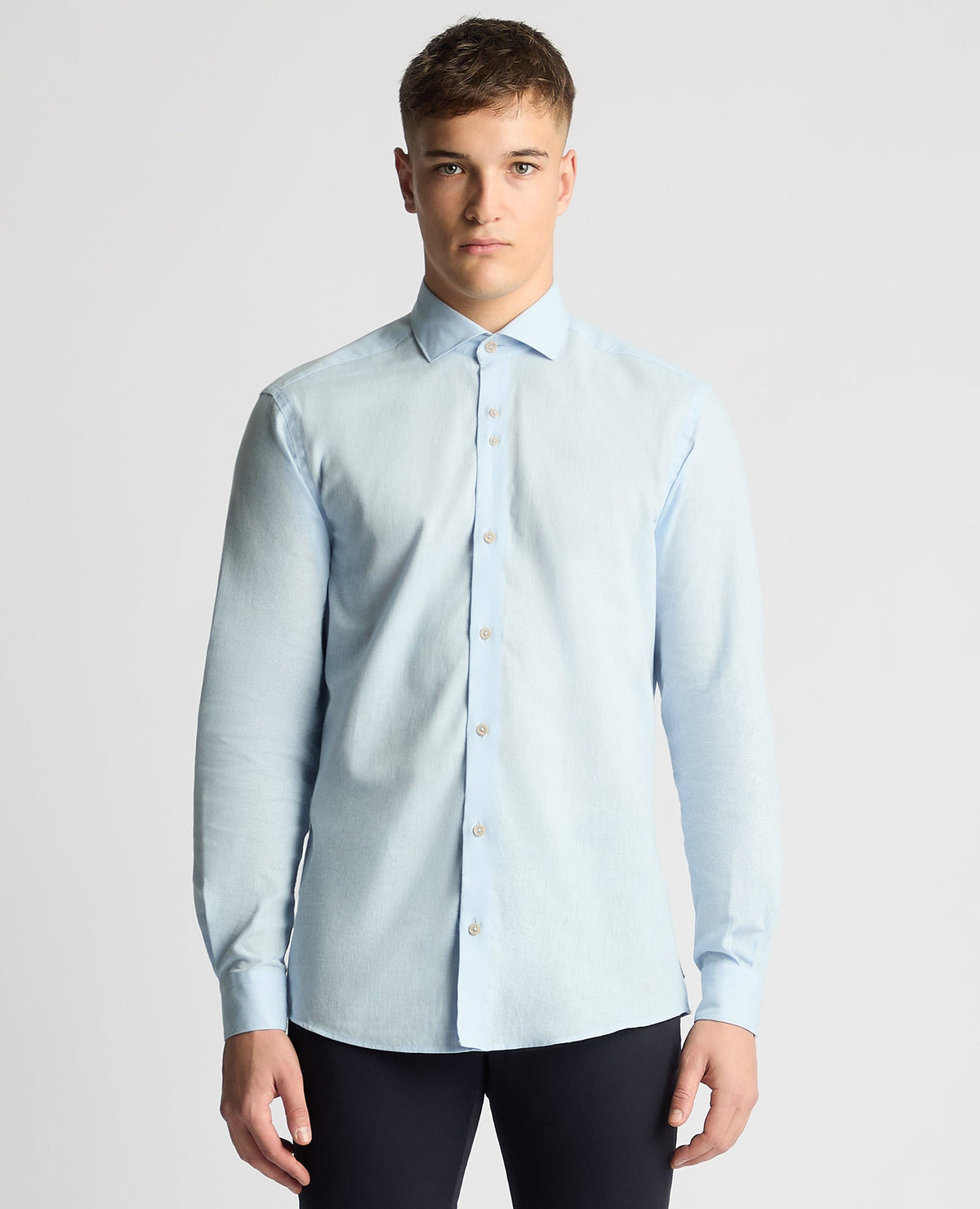Man wearing a blue Tapered Fit Cotton-Linen Blend Shirt