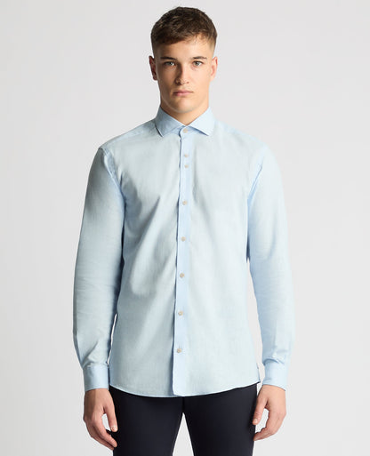 Man wearing a blue Tapered Fit Cotton-Linen Blend Shirt