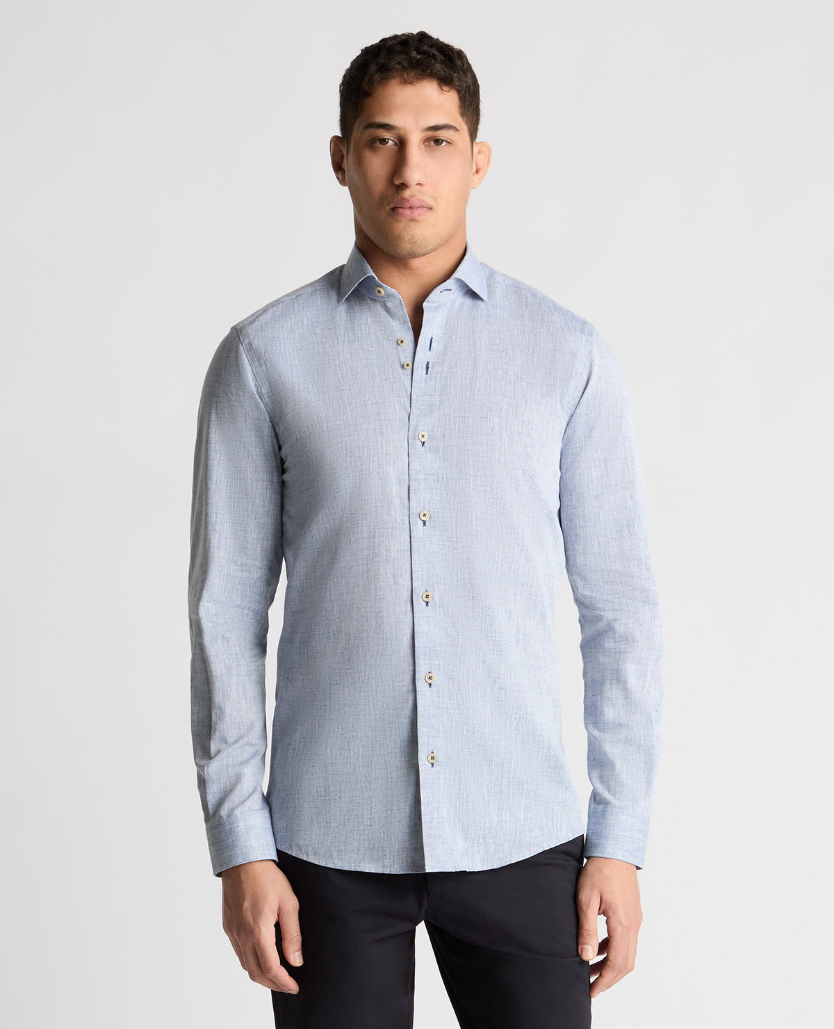 Man wearing a blue casual shirt