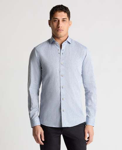 Man wearing a blue casual shirt