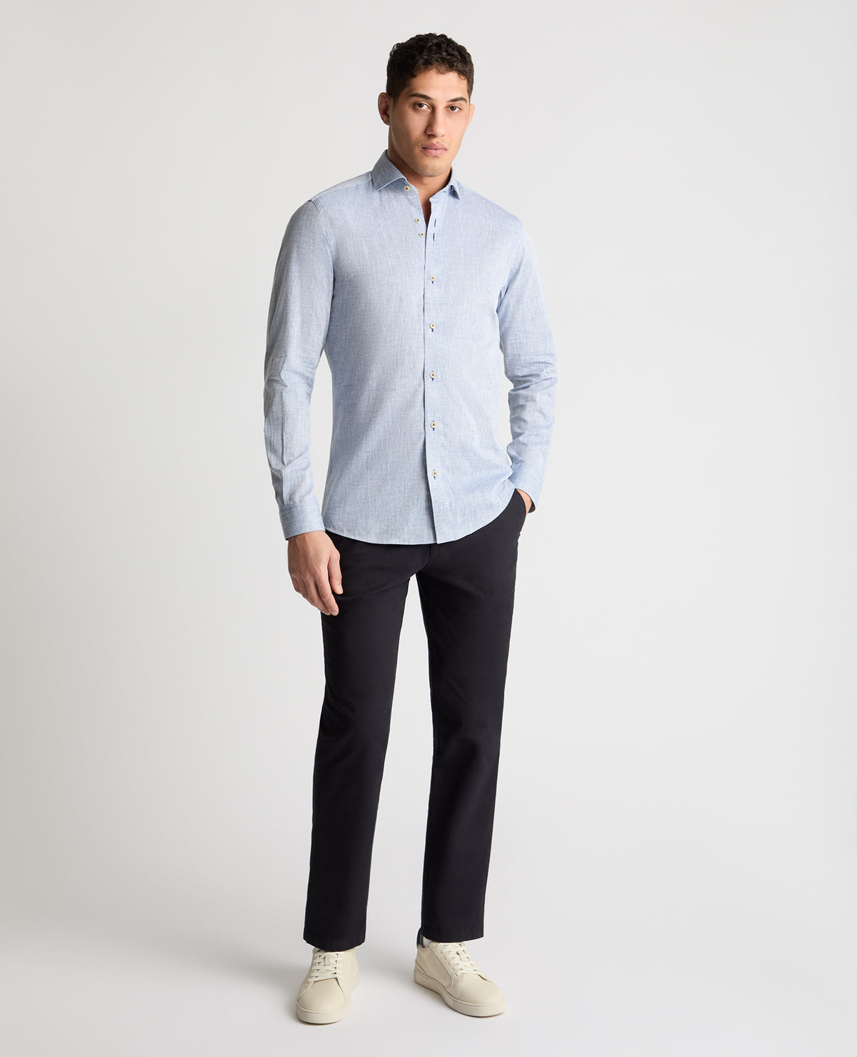 Man wearing a blue casual shirt