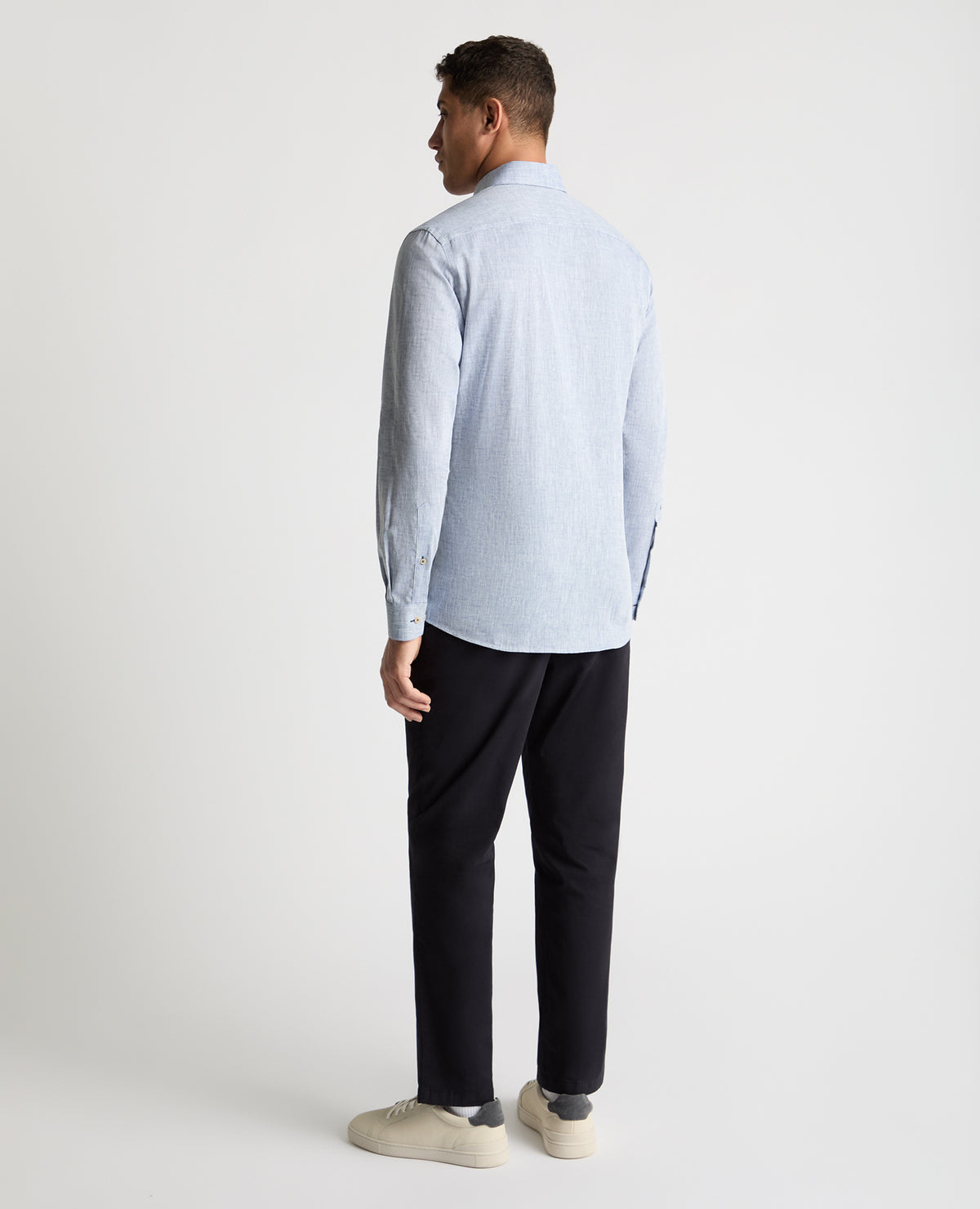 Man wearing a blue casual shirt