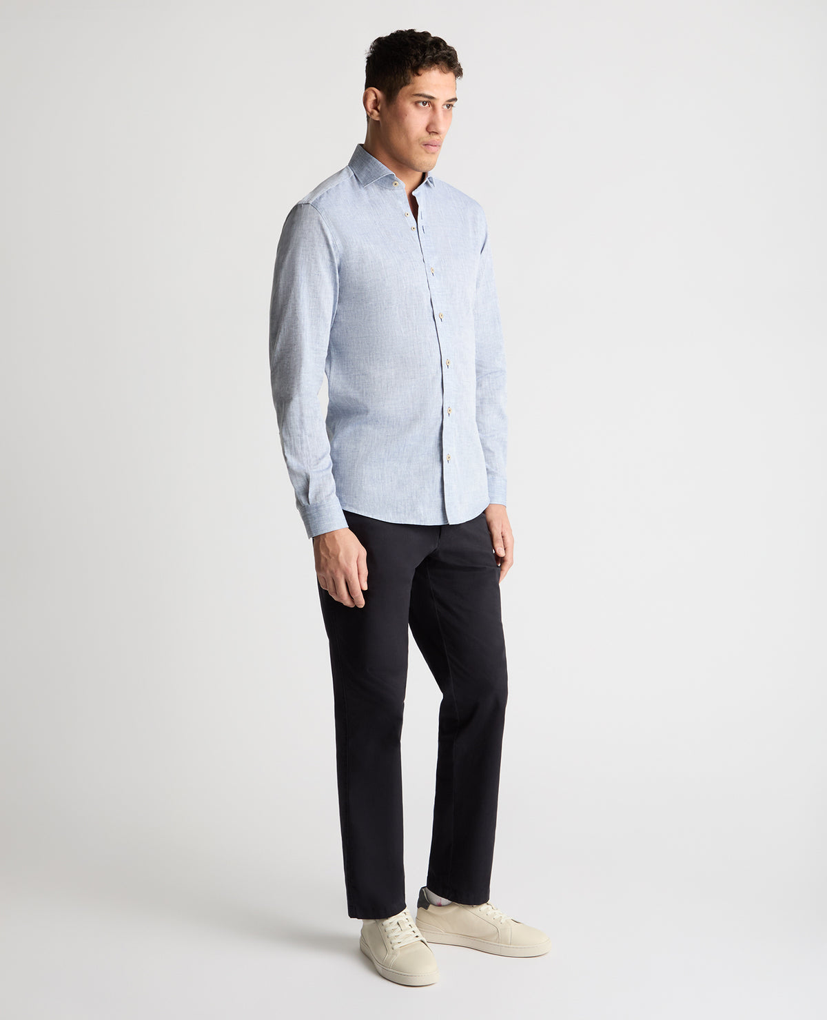 Man wearing a blue casual shirt