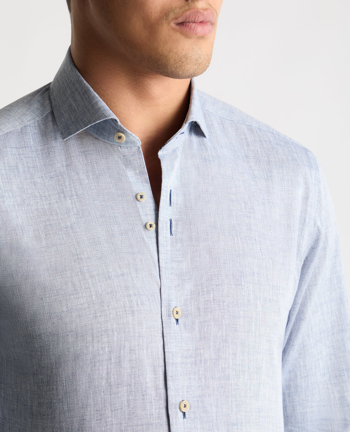 Man wearing a blue casual shirt