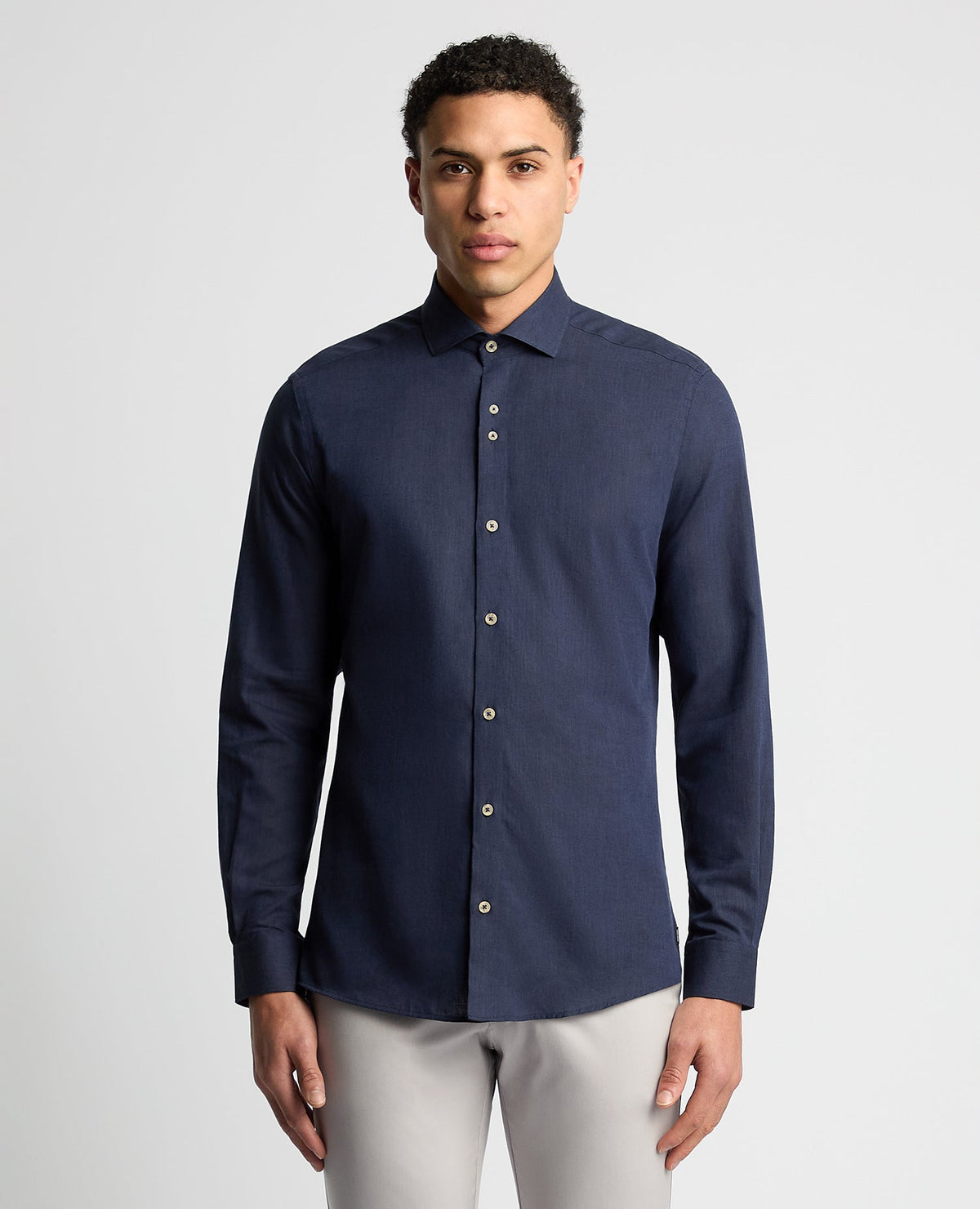 Man wearing a navy Tapered Fit Cotton-Linen Blend Shirt