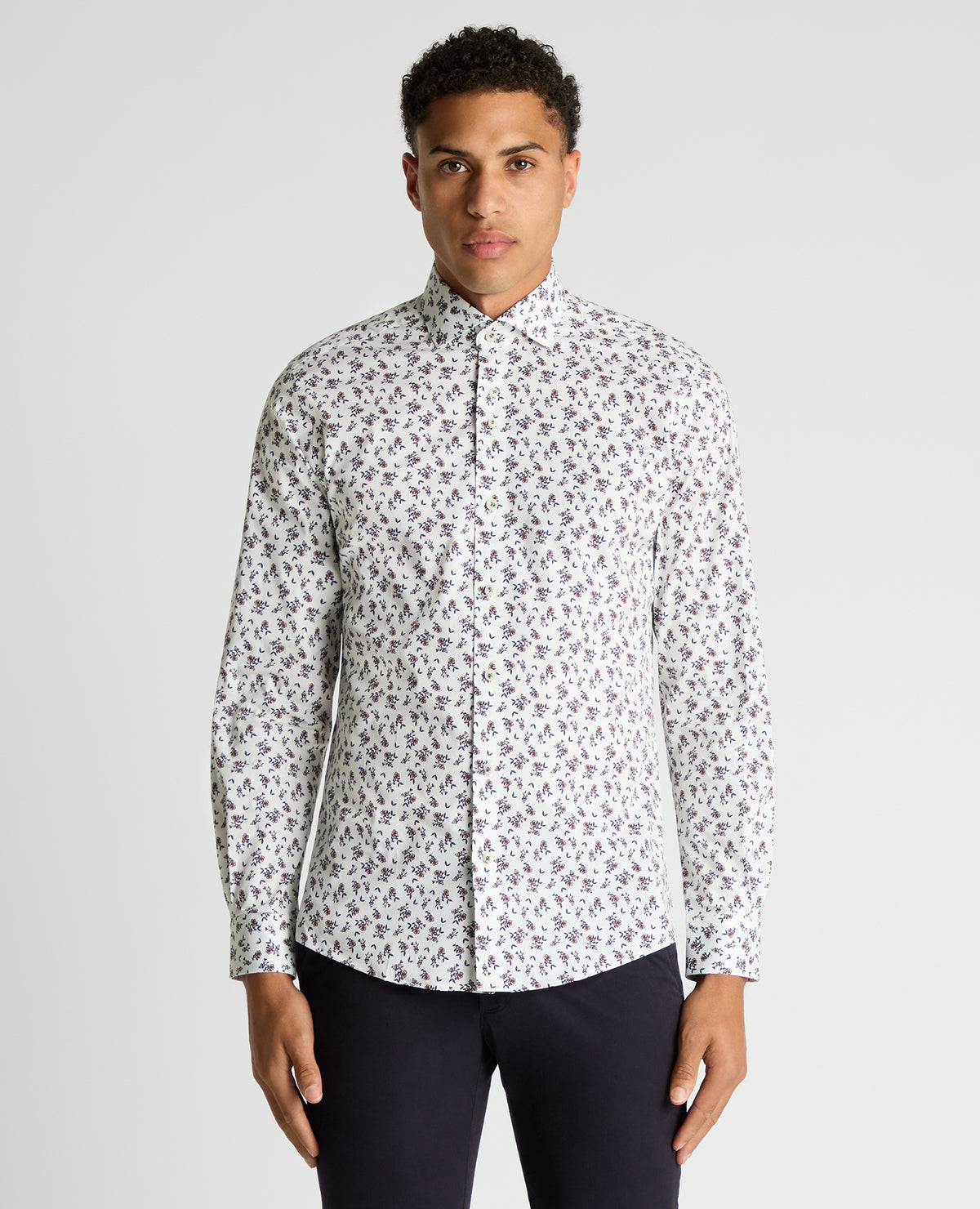 Man wearing a navy Tapered Fit Floral Cotton-Stretch Shirt