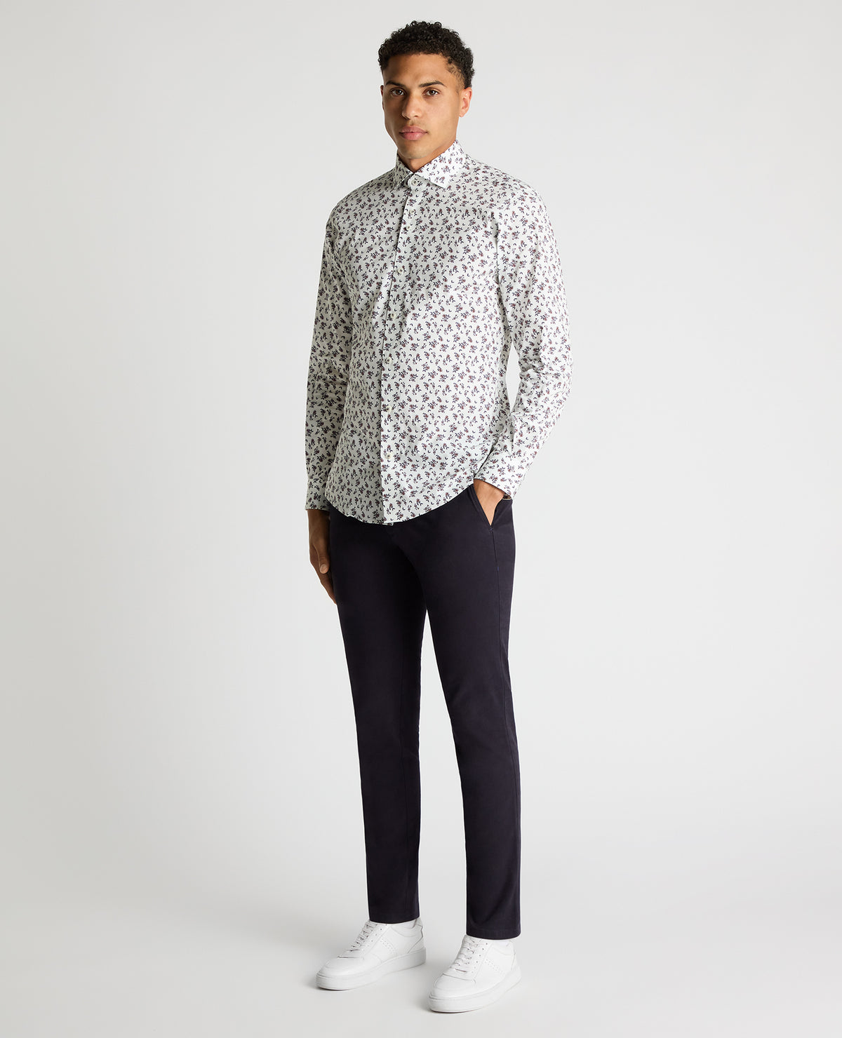 Man wearing a navy Tapered Fit Floral Cotton-Stretch Shirt