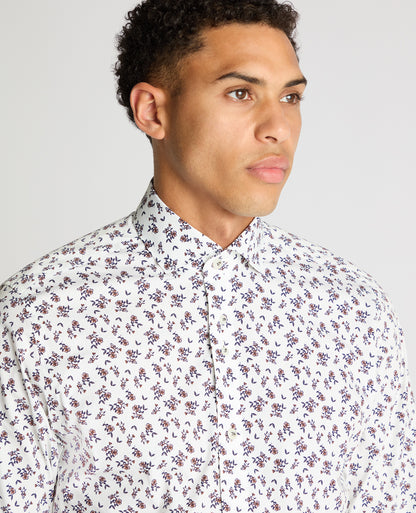 Man wearing a navy Tapered Fit Floral Cotton-Stretch Shirt