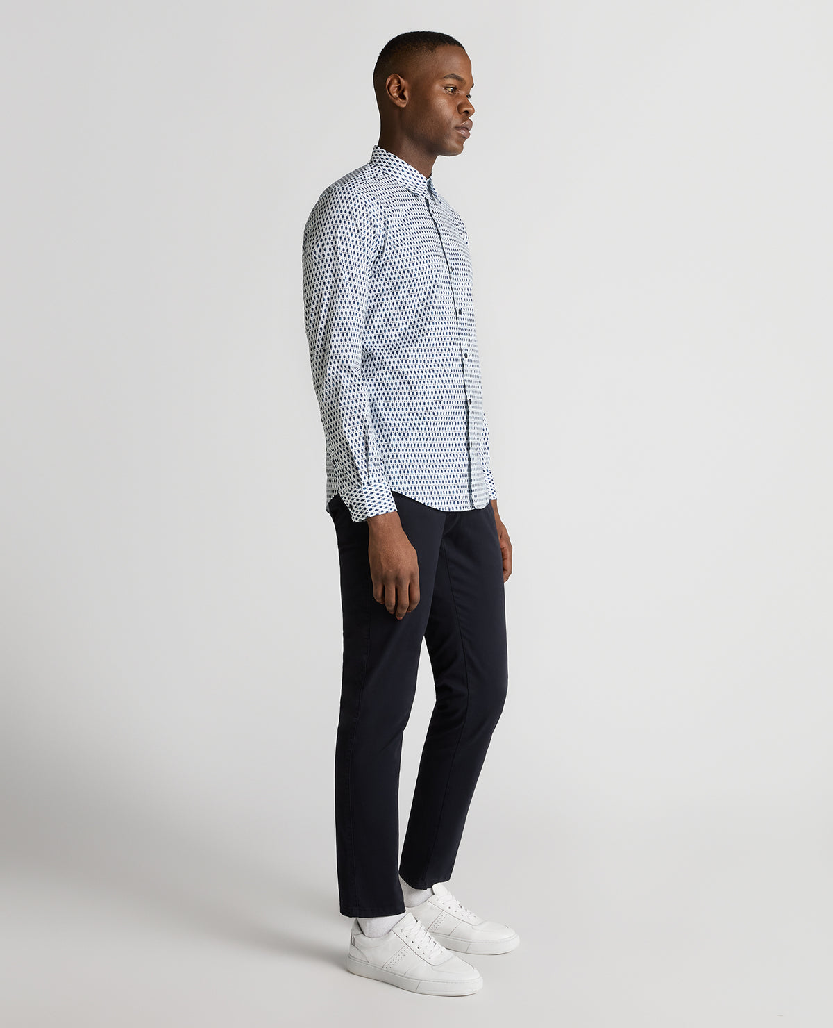 Man wearing a navy Regular Fit Print Cotton-Stretch Shirt