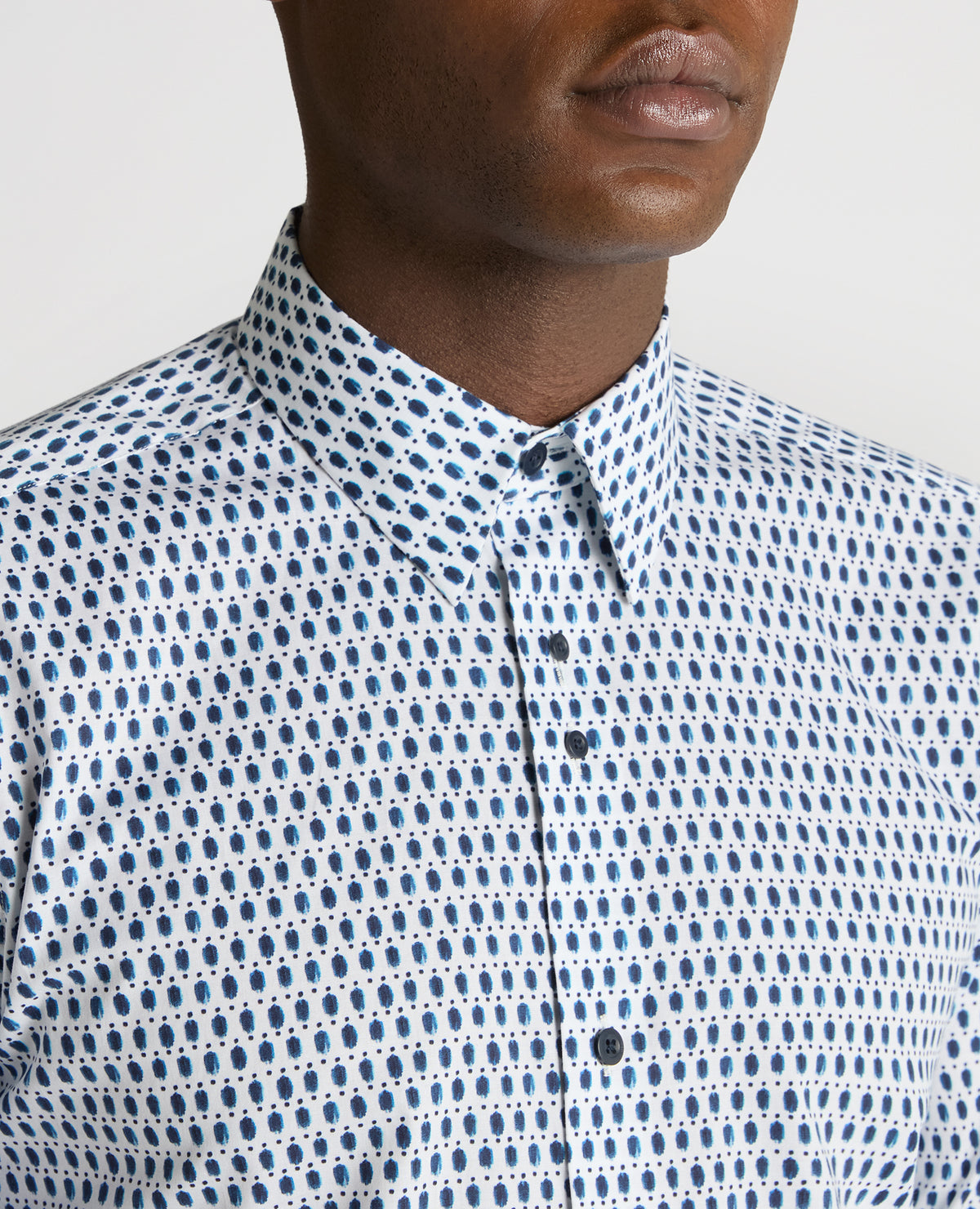 Man wearing a navy Regular Fit Print Cotton-Stretch Shirt