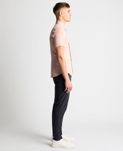 Man wearing a pink Slim Fit Cotton Stretch Short Sleeve Shirt