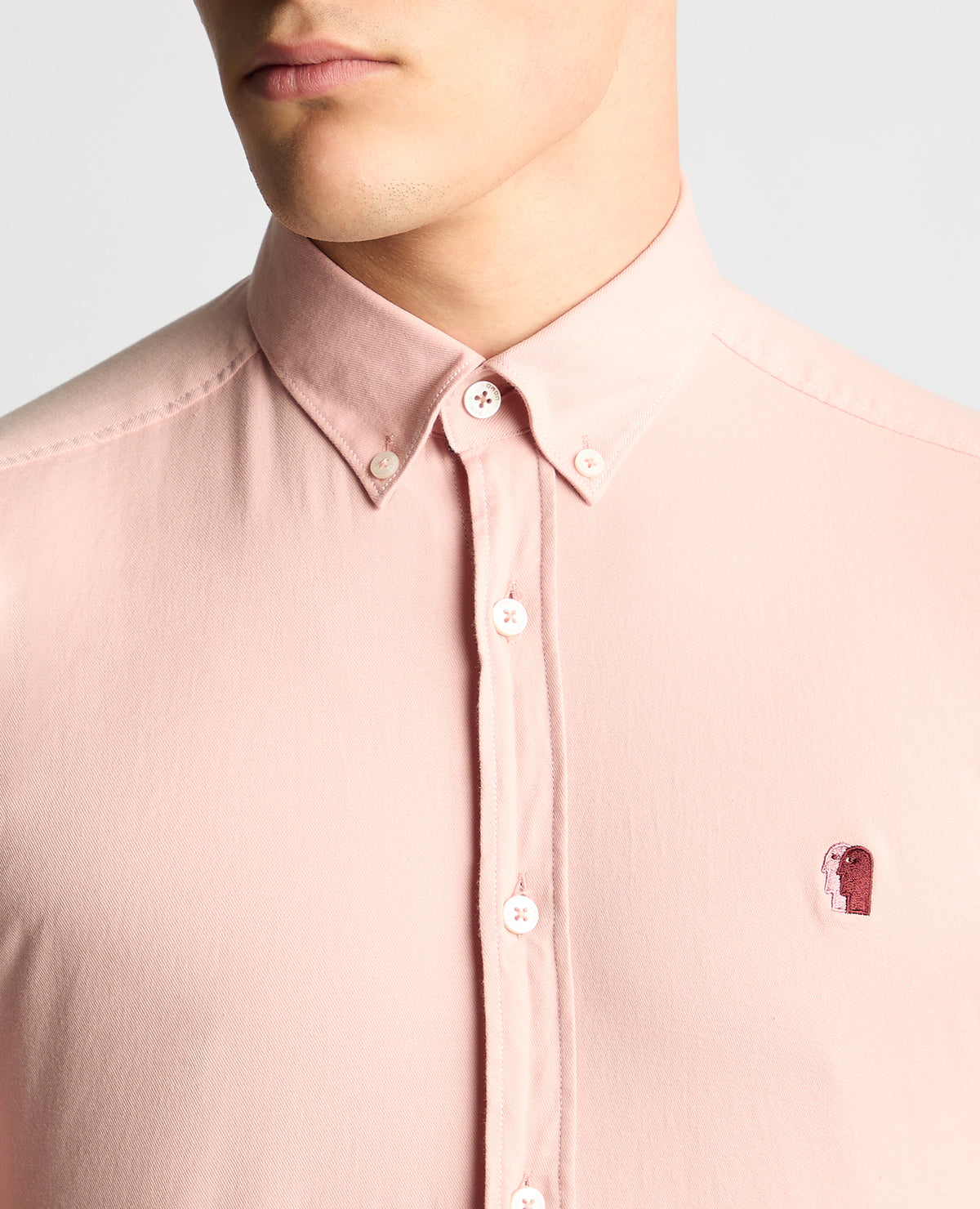 Man wearing a pink Slim Fit Cotton Stretch Short Sleeve Shirt