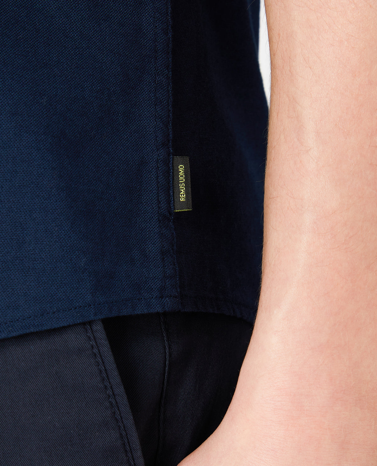 Man wearing a navy Slim Fit Oxford Cotton Short Sleeve Shirt