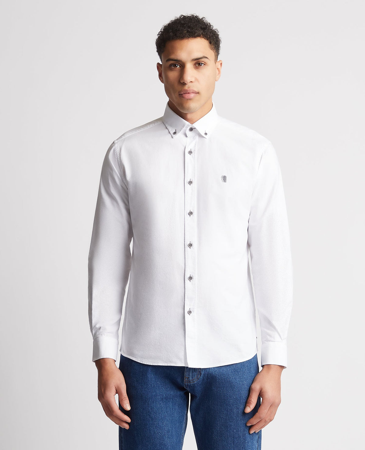 Man wearing a white Tapered Fit Oxford Cotton Shirt